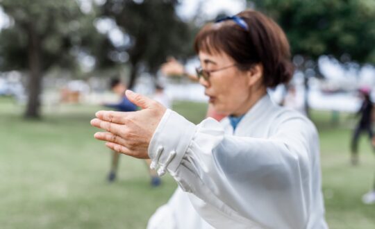 Mature chinese woman do tai chi outdoor